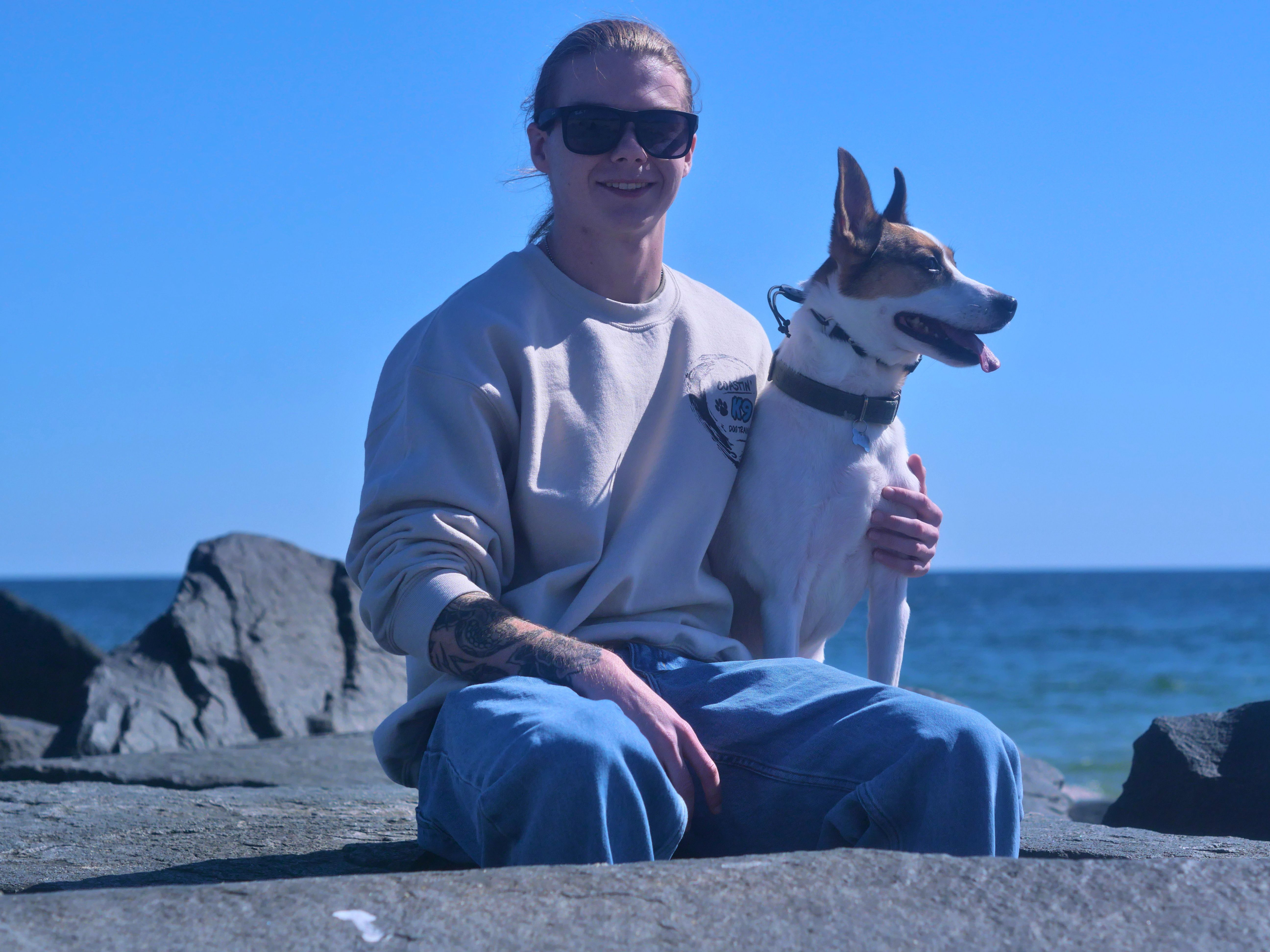Dylan with his dog at the Jersey Shore